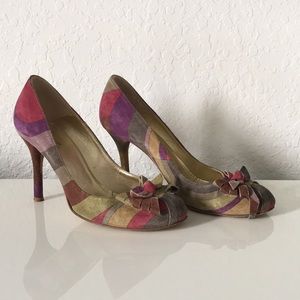 Etro suede printed heels with bow accent.